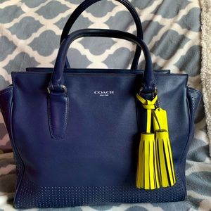 Coach Navy zipper bag with yellow tassel